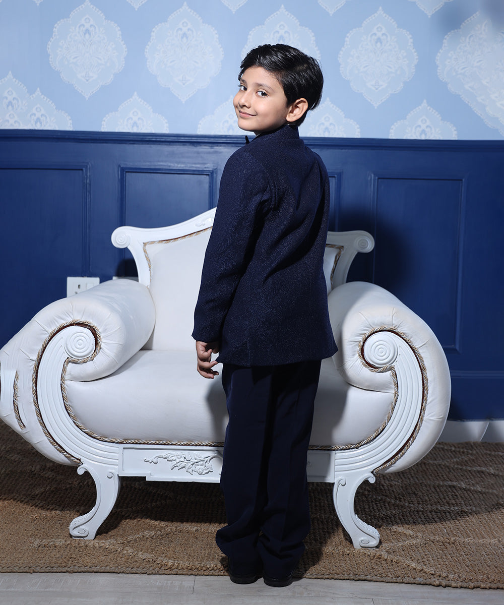 back view of navy blue shimmer coat suit set for boys 